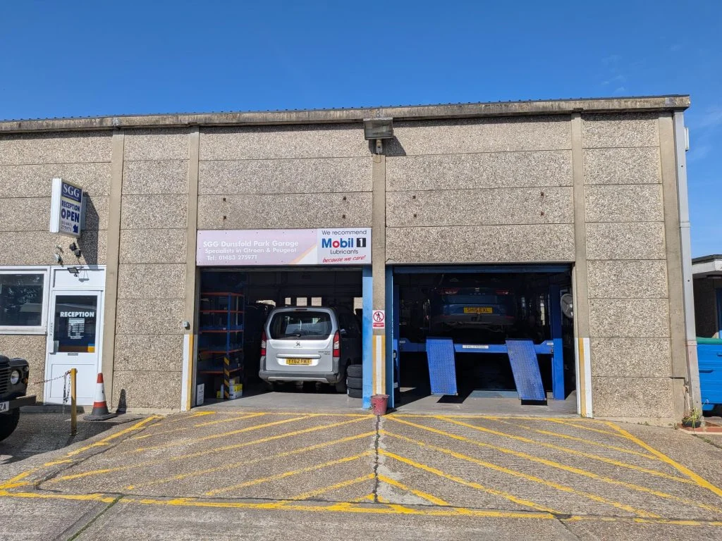 Two open workshop bays at the garage